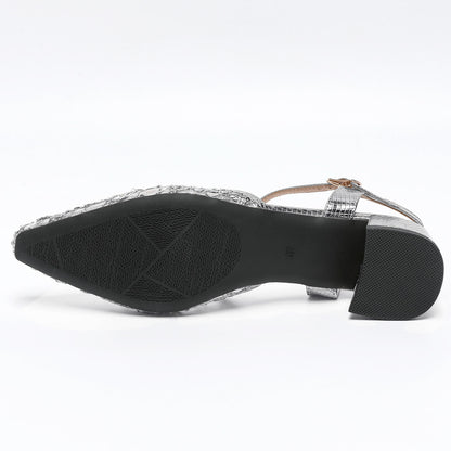 Bottom view of women's silver mesh glitter pumps with an elegant pointed toe
