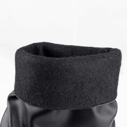 Close-up view of black moto mid calf biker boots, fold over shaft with soft fleece warm lining detail