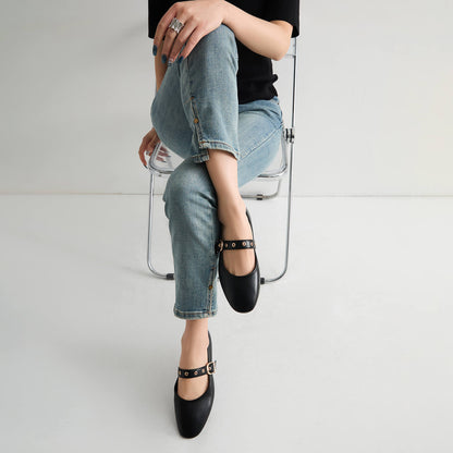 Model wearing black Mary Jane flats with jeans for an office look